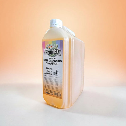 Houndsly Deep Cleansing Dog Shampoo in Mango & Lime scent. Natural, vegan, sustainable formula in a large plastic bottle.
