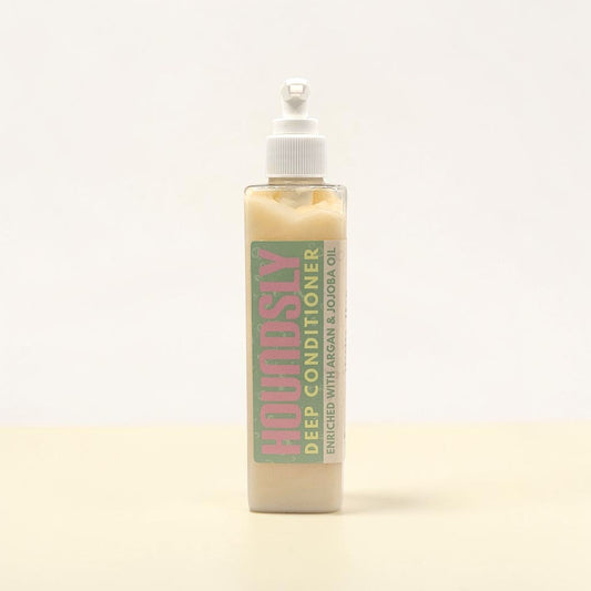 Houndsly Deep Conditioner for dogs in a clear pump bottle, enriched with argan & jojoba oil.