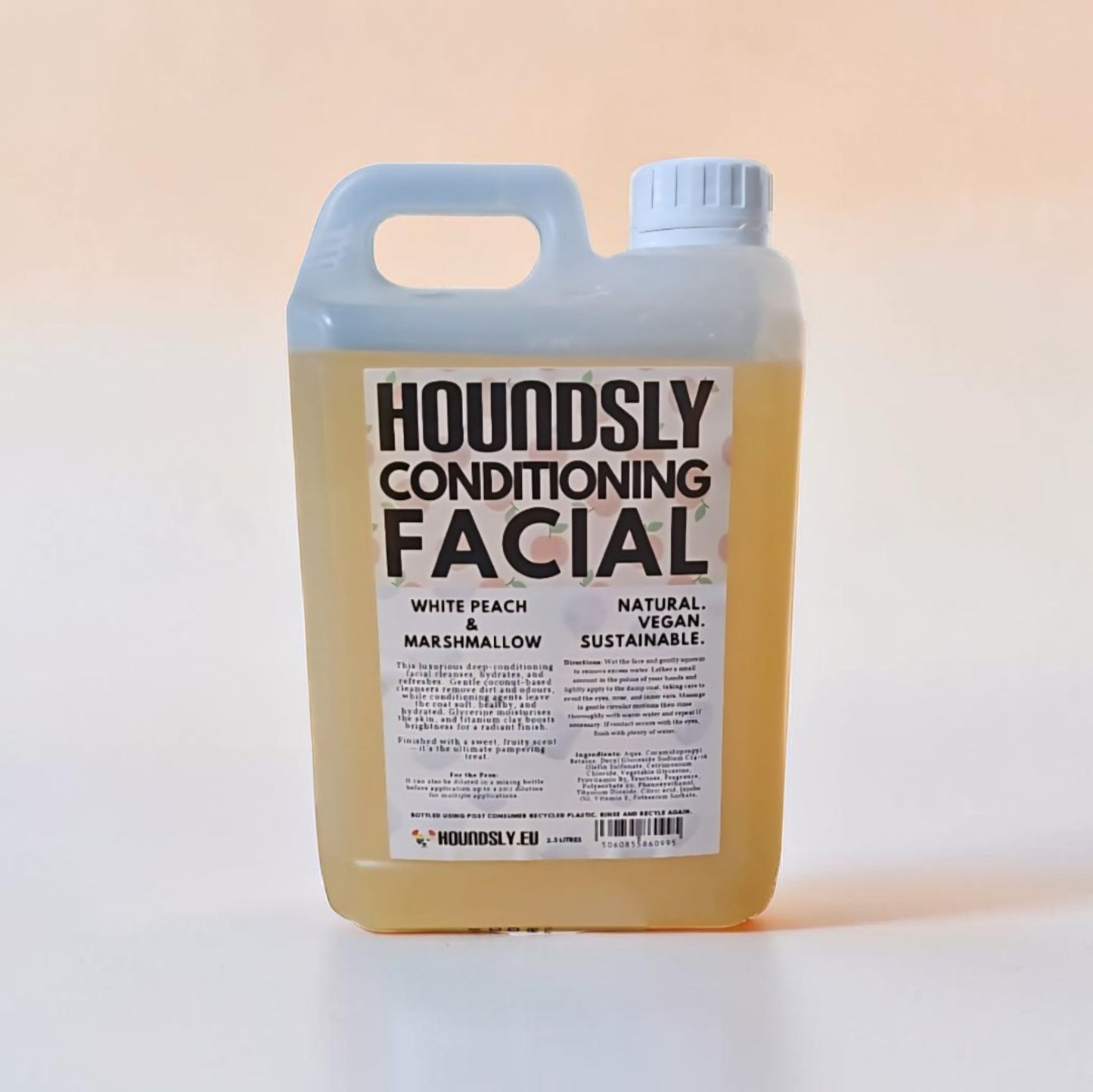 Houndsly White Peach & Marshmallow Dog Facial conditioning treatment in a clear plastic jug. Natural, vegan, sustainable.