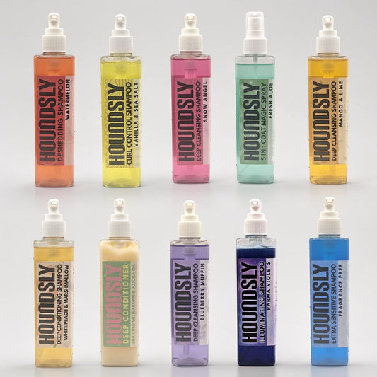 Houndsly EU Pet Products Ultimate Starter Pack with 10 shampoos, 1 coat magic spray, and 1 deep conditioner in various scents and colors.