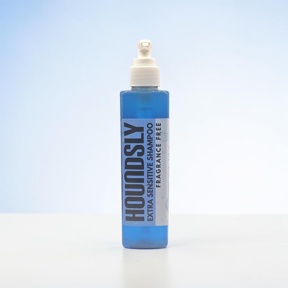 Houndsly EU Pet Products blue bottle of fragrance-free extra sensitive dog shampoo with pump dispenser.
