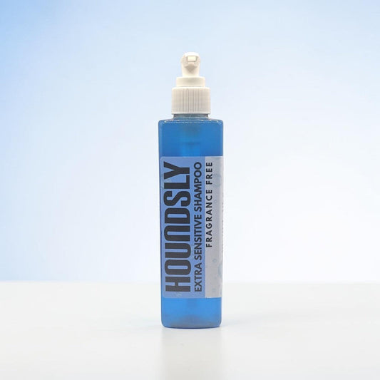 Houndsly EU Pet Products blue bottle of fragrance-free extra sensitive dog shampoo with pump dispenser.