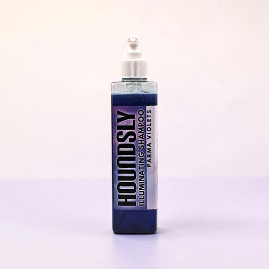Frente Perfumada Ltd, T/A Houndsly EU Pet Products Illuminating Dog Shampoo in Parma Violets scent, a clear bottle with purple shampoo and a white pump dispenser.
